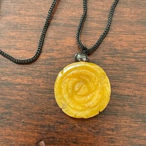 Hand carved yellow aventurine rose pendant black satin cord